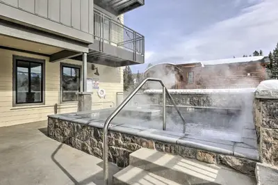 a hot tub outside of a house at Newly Built Ski Condo with Hot Tub and Shuttle Access! in Winter Park
