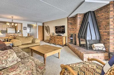 a living room with a couch and a fireplace at Mtn Views and Hot Tub Access Lake Dillon Retreat in Dillon