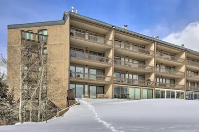 a building with snow in front of it at Mtn Views and Hot Tub Access Lake Dillon Retreat in Dillon