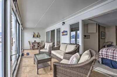 a living room with chairs and a couch and a table at Mtn Views and Hot Tub Access Lake Dillon Retreat in Dillon