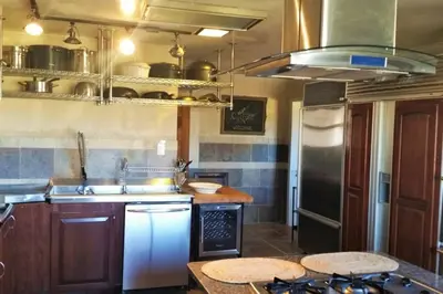 a kitchen with a sink and a stove at Casa Vista in Fraser