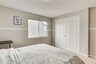 a bedroom with a bed and a window at Fenced Yard and Trail Access Dog-Friendly Erie Home in Erie
