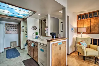 a large kitchen with a sink and a window at Lakefront Fort Collins Townhome, Only 3 Mi to CSU! in Fort Collins
