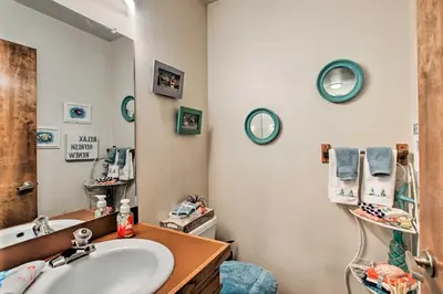a bathroom with a sink and a mirror at Lakefront Fort Collins Townhome, Only 3 Mi to CSU! in Fort Collins