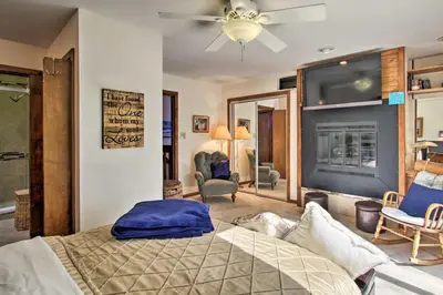 a bedroom with a bed and a ceiling fan at Lakefront Fort Collins Townhome, Only 3 Mi to CSU! in Fort Collins