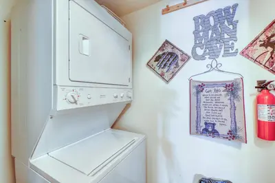 a laundry room with a white washer and dryer at Revett Retreat in Breckenridge