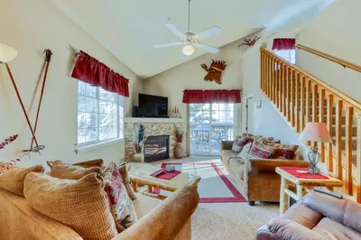a living room with couches and a fireplace at Revett Retreat in Breckenridge