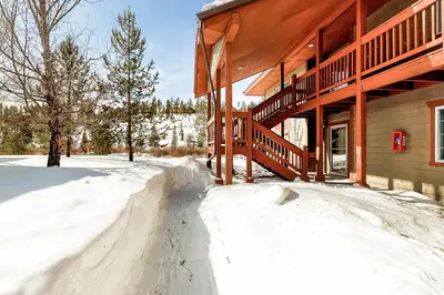 a snow covered driveway leading to a house at Revett Retreat in Breckenridge