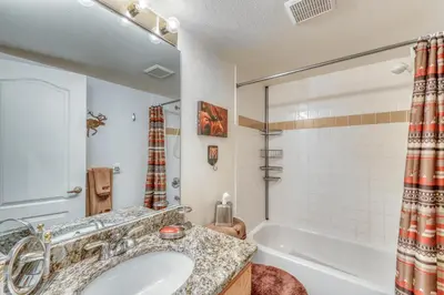 a bathroom with a sink and a tub and a shower at Revett Retreat in Breckenridge