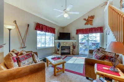 a living room with two couches and a fireplace at Revett Retreat in Breckenridge
