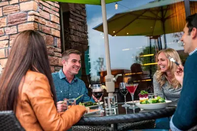 a group of people sitting at a table in a restaurant at Denver Marriott Westminster in Westminster