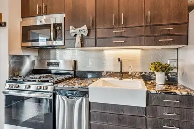a kitchen with a sink and a stove at Treehouse 1BR with Hot Tub home in Black Hawk