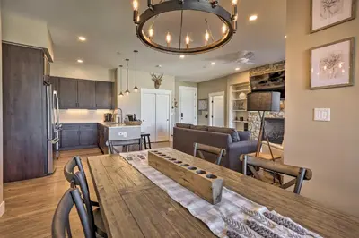 a kitchen and a living room with a table in a room at Condo with View - 1 Block to Main St - 4 Mi to Ski! in Winter Park