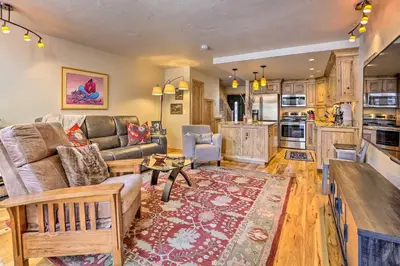 a living room with a couch and a table at 7 Mi to Ski Waterfront Townhome in Frisco! in Frisco