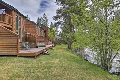 a house with a deck next to a body of water at 7 Mi to Ski Waterfront Townhome in Frisco! in Frisco