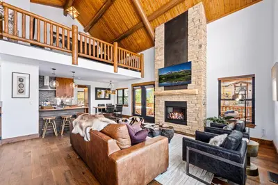a living room with a couch and a fireplace at Estes Retreat – Indoor/Outdoor Fireplace, Jacuzzi, Close to Downtown Estes in Estes Park