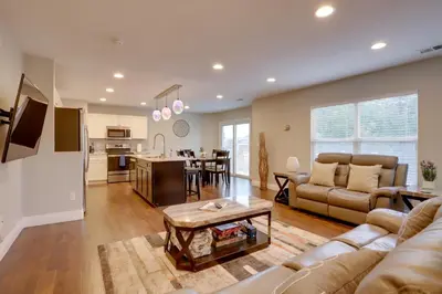 a living room with a couch and a table at Denver Getaway Close to Downtown, Mtns, and Boulder in Thornton