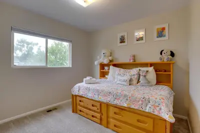 a bedroom with a bed and a window at Denver Getaway Close to Downtown, Mtns, and Boulder in Thornton