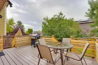a patio with a table and chairs and a grill at Denver Getaway Close to Downtown, Mtns, and Boulder in Thornton