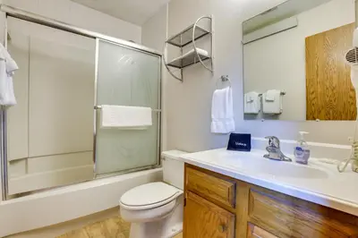 a bathroom with a toilet and a sink and a shower at Mtn Condo with Ski Locker and Pools - 3 Mi to Resort! in Winter Park