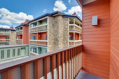 a balcony of a apartment building with a chimney at Mtn Condo with Ski Locker and Pools - 3 Mi to Resort! in Winter Park