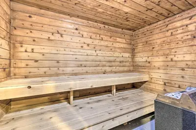 a wooden sauna with a bench in it at Mtn Condo with Ski Locker and Pools - 3 Mi to Resort! in Winter Park