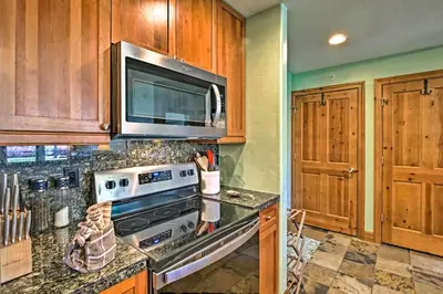 a kitchen with a stove and a microwave at Couples Ski Condo 1 Mi to Breckenridge Golf Club in Breckenridge