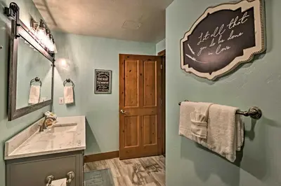 a bathroom with a sink and a chalkboard on the wall at Couples Ski Condo 1 Mi to Breckenridge Golf Club in Breckenridge