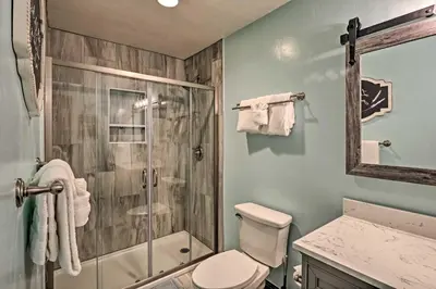 a bathroom with a shower and a toilet and a sink at Couples Ski Condo 1 Mi to Breckenridge Golf Club in Breckenridge