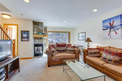a living room with two couches and a tv at Airy Winter Park Gem with Private Outdoor Hot Tub! in Winter Park