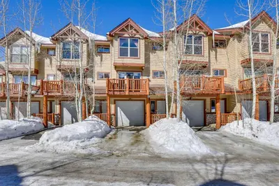 a large house with snow in front of it at Airy Winter Park Gem with Private Outdoor Hot Tub! in Winter Park