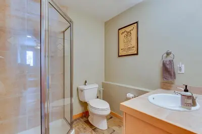 a bathroom with a shower and a toilet and a sink at Airy Winter Park Gem with Private Outdoor Hot Tub! in Winter Park
