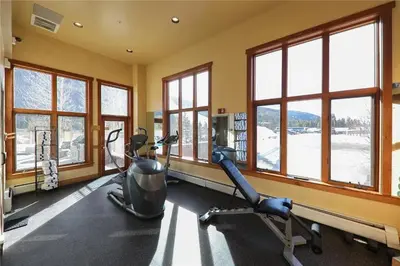 a gym with two exercise bikes and windows at Full Renovated 1BR -Walk to Gondola & Kids Ski Free condo in Dillon