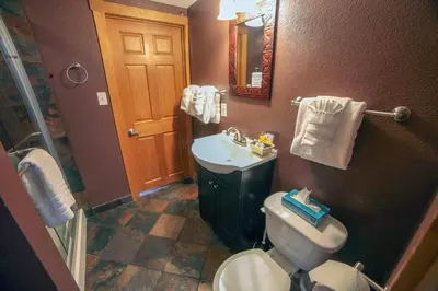 a bathroom with a toilet and a sink at Rocky Mountain Retreat 2 by Rocky Mountain Resorts in Estes Park
