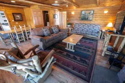 a living room with a couch and a table at Rocky Mountain Retreat 2 by Rocky Mountain Resorts in Estes Park