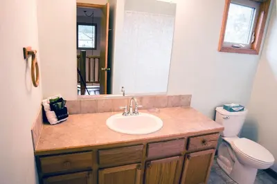 a bathroom with a sink and a toilet and a mirror at Virginia Home by Rocky Mountain Resorts- #3106 in Estes Park
