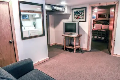 a living room with a couch and a television at Stonehaven Home by Rocky Mountain Resorts- #3384 in Estes Park
