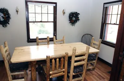 a wooden table and chairs in a dining room at Stonehaven Home by Rocky Mountain Resorts- #3384 in Estes Park