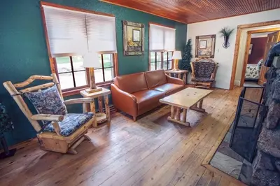 a living room with a leather couch and chairs at Monte Verde by Rocky Mountain Resorts- #20NCD0297 in Estes Park