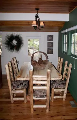 a dining room with a wooden table and chairs at Monte Verde by Rocky Mountain Resorts- #20NCD0297 in Estes Park