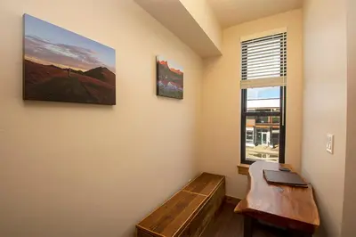 a room with a bench and a window at Arrow at Winter Park Unit 286 in Winter Park