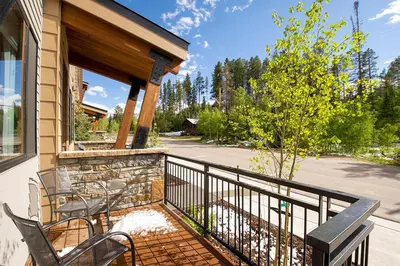 a porch with two chairs and a fence at Arrow at Winter Park Unit 286 in Winter Park