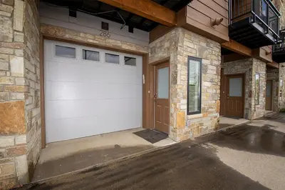 a white garage door on the side of a house at Arrow at Winter Park Unit 286 in Winter Park