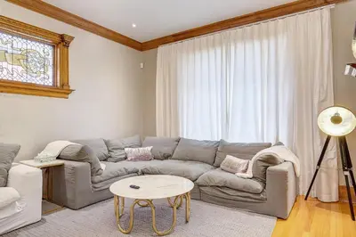 a living room with a couch and a table at Stunning Historic Home - DT Location! - Sleeps 8 in Denver