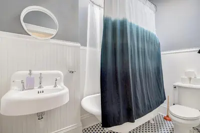 a bathroom with a sink and a toilet at Stunning Historic Home - DT Location! - Sleeps 8 in Denver