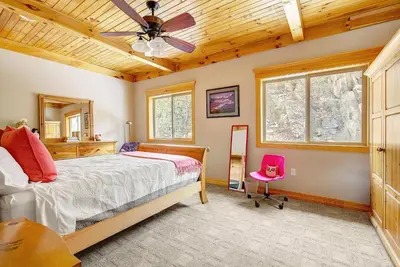 a bedroom with a bed and a wooden ceiling at Secluded & Spacious Mountain Getaway in Morrison