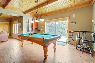 a pool table in the middle of a room at Secluded & Spacious Mountain Getaway in Morrison
