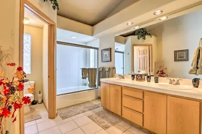 a bathroom with two sinks and a large mirror at 10 Mi to Breckenridge Townhome with Hot Tub and Deck! in Frisco