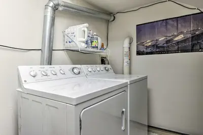 a white washer and dryer in a room at 10 Mi to Breckenridge Townhome with Hot Tub and Deck! in Frisco