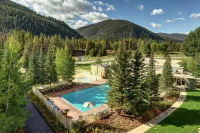 an overhead view of a swimming pool in a yard with trees at Seasons 3 Bedroom Townhome At Lakeside Village in Keystone
